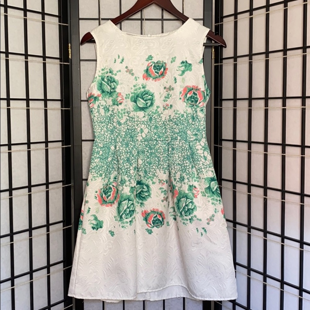 White short dress with green floral pattern